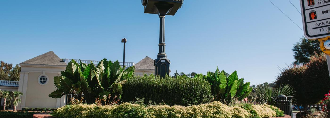 The city clock tower at the intersections of Forest Drive and Trenholm Road.